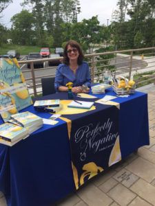 Author Linda Carvelli in a fun and share-friendly photo at her book signing.